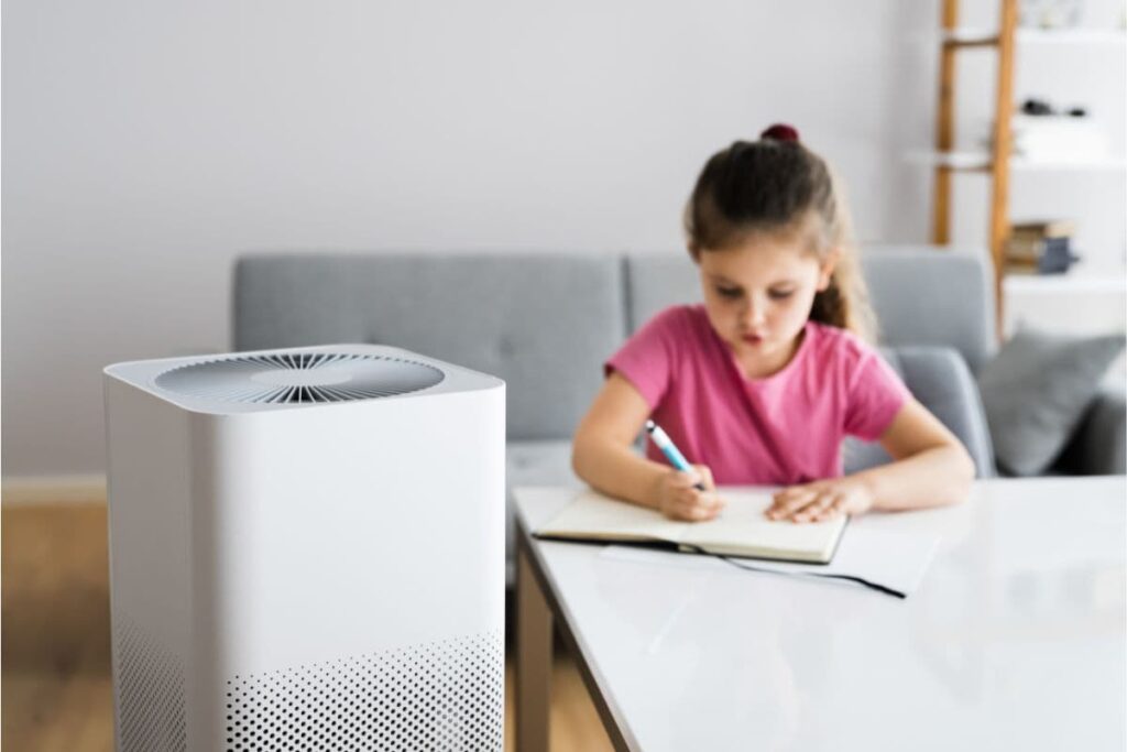 A Young Kid in a Room with an Air Purifier